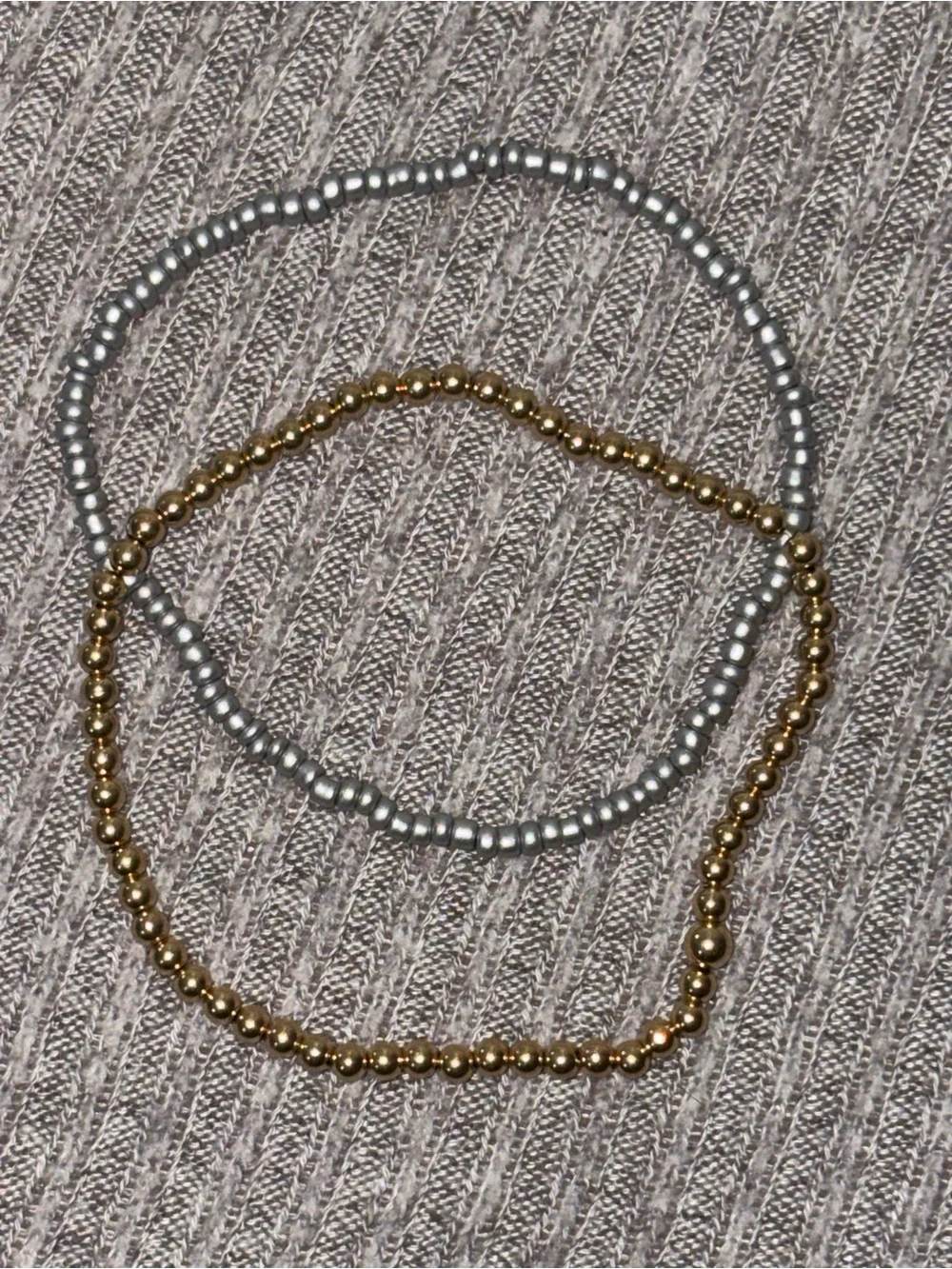 Set of 2 vintage beaded stretch bracelets-one silver colored, other gold colored